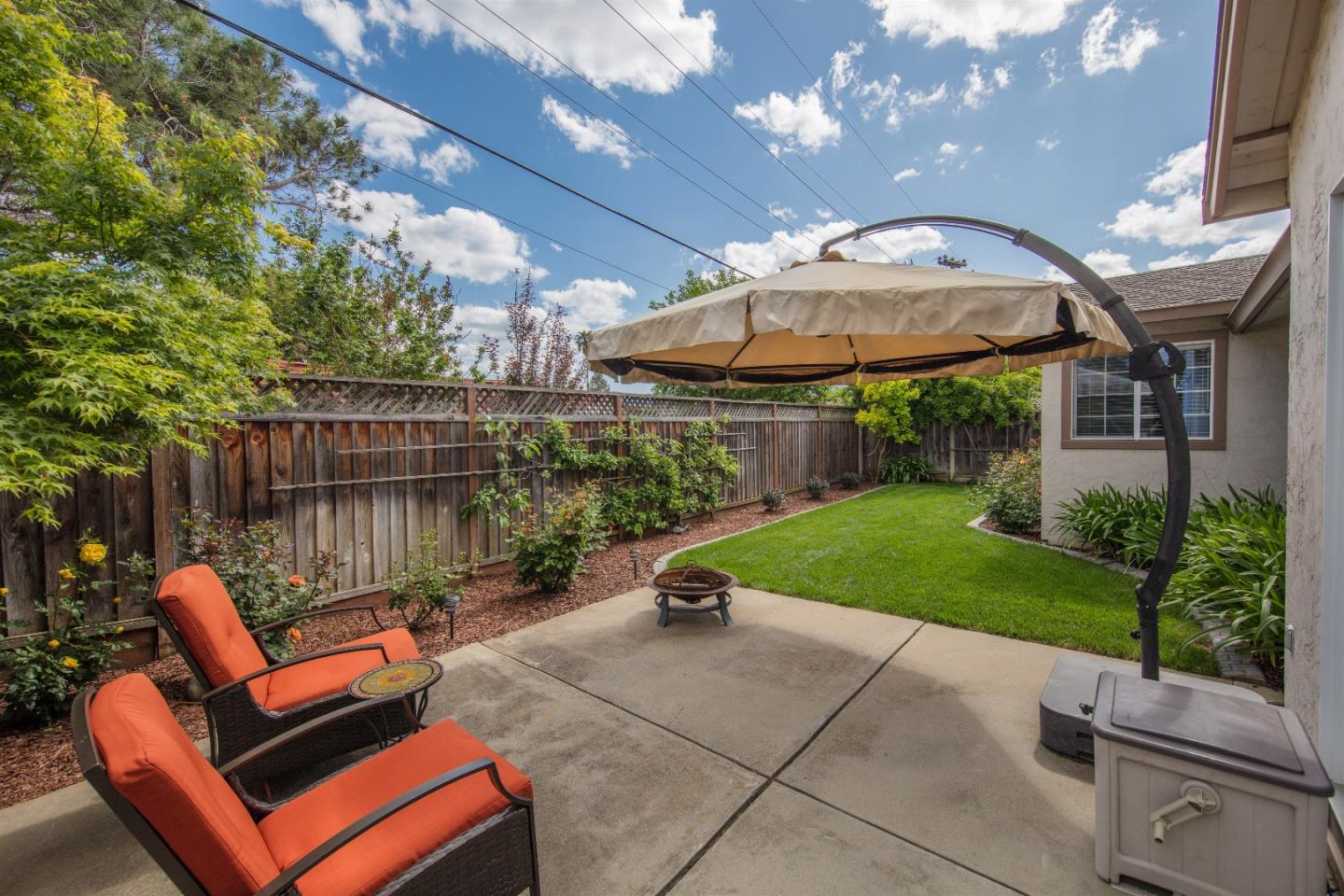 1686 Ebbetts Drive Campbell, CA 95008 - Photo 29 of 31 a backyard of a house with a garden and outdoor seating