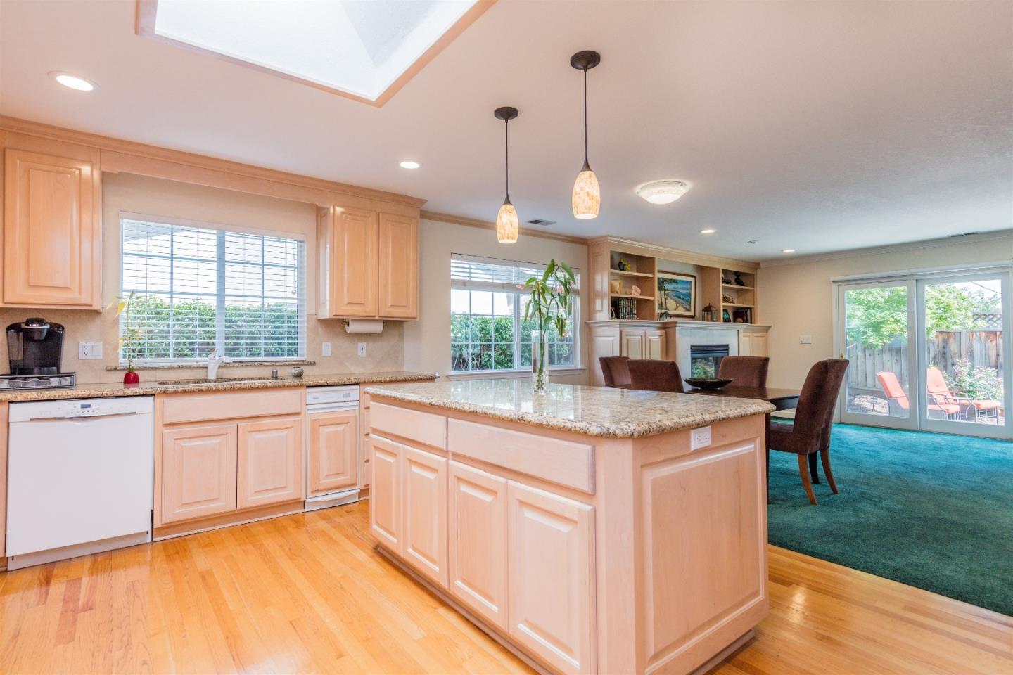 1686 Ebbetts Drive Campbell, CA 95008 - Photo 7 of 31 a open kitchen with stainless steel appliances granite countertop a stove and a sink