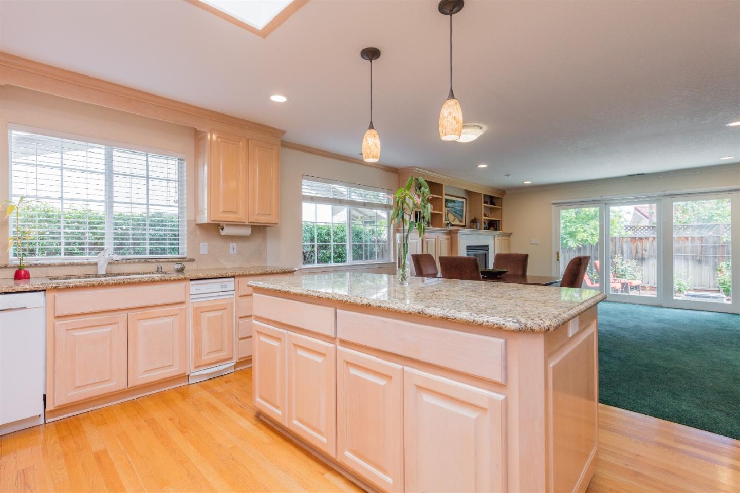 1686 Ebbetts Drive Campbell, CA 95008 - Photo 9 of 31 a kitchen with granite countertop cabinets a sink a window and stainless steel appliances