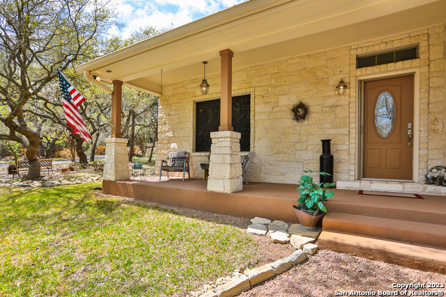 8729 Fair Oaks Parkway Fair Oaks Ranch, TX 78015 - Photo 2 of 11 a front view of a house with garden