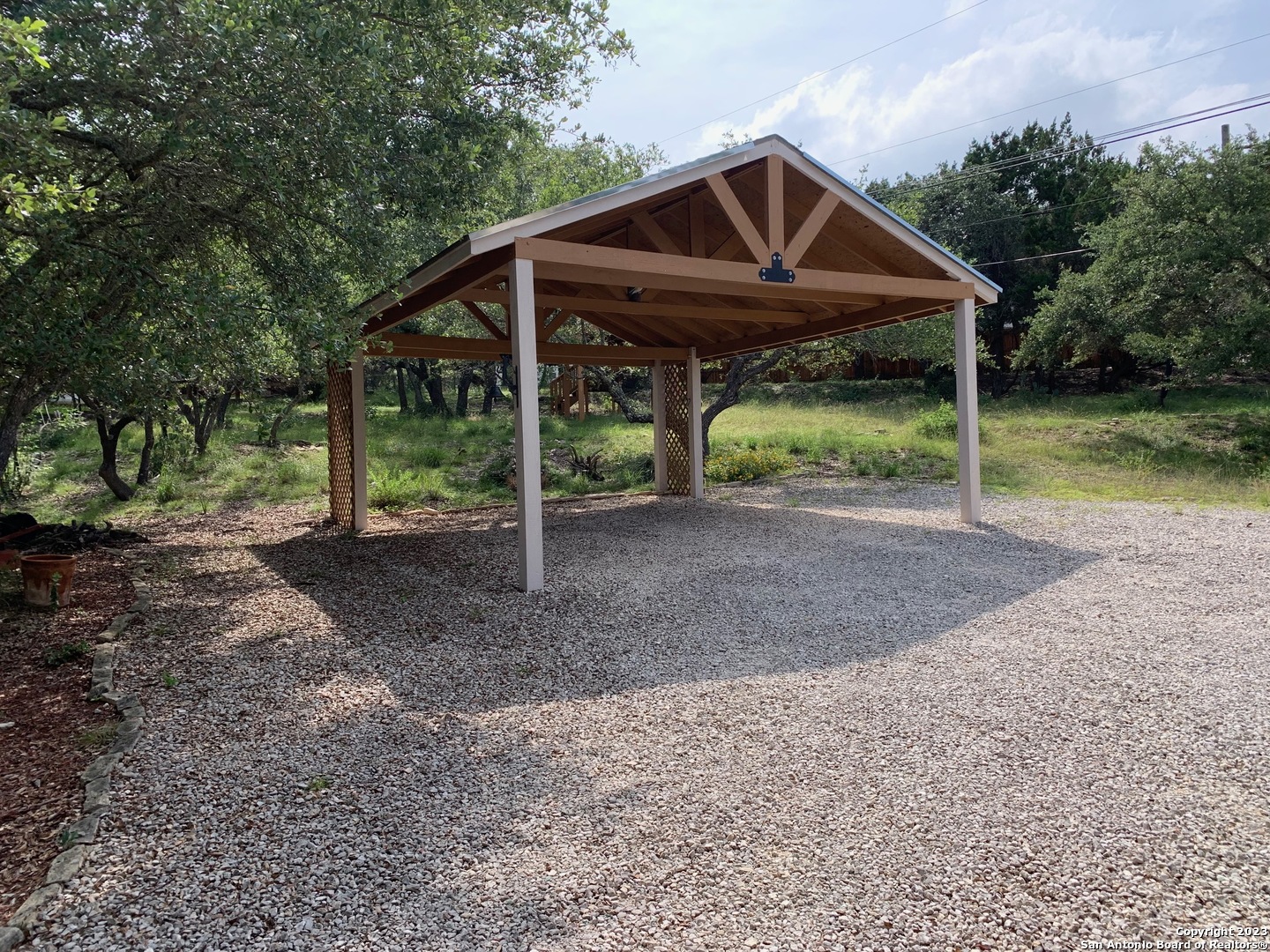 8729 Fair Oaks Parkway Fair Oaks Ranch, TX 78015 - Photo 9 of 11 a view of a house with backyard and entertaining space