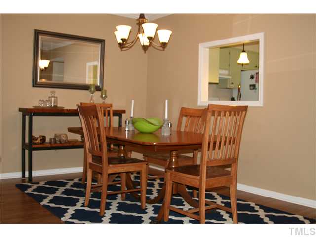 1524 Woodcroft Drive Raleigh, NC 27609 - Photo 13 of 25 a view of a dining room with furniture