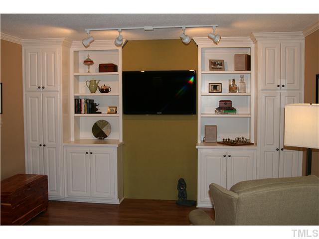1524 Woodcroft Drive Raleigh, NC 27609 - Photo 2 of 25 a living room with furniture and a flat screen tv