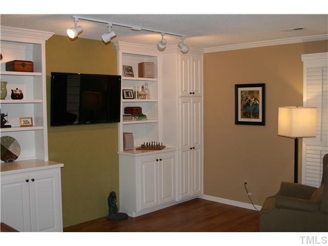 1524 Woodcroft Drive Raleigh, NC 27609 - Photo 3 of 25 a view of a livingroom with furniture and cabinet