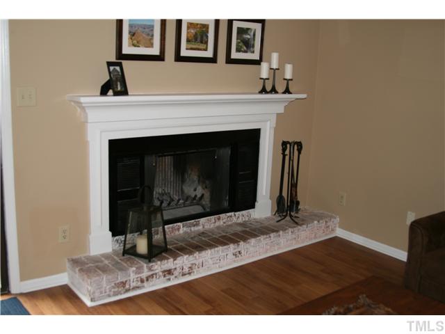1524 Woodcroft Drive Raleigh, NC 27609 - Photo 4 of 25 a living room with a fireplace