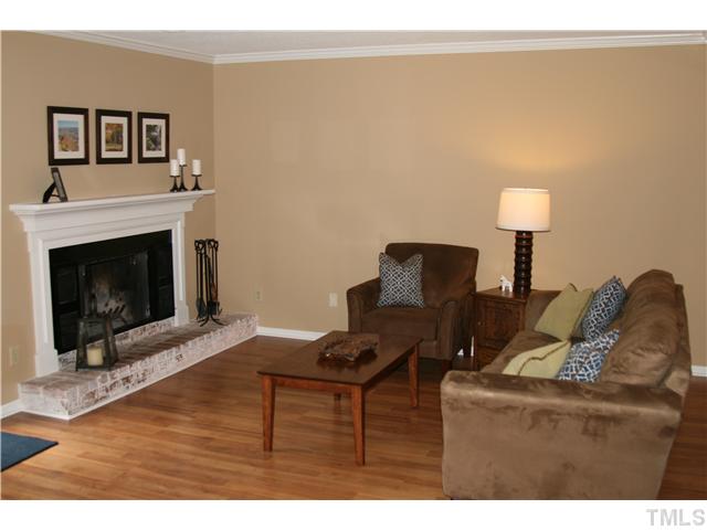 1524 Woodcroft Drive Raleigh, NC 27609 - Photo 6 of 25 a living room with furniture and a fireplace