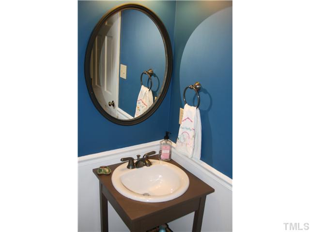 1524 Woodcroft Drive Raleigh, NC 27609 - Photo 8 of 25 a bathroom with a sink and a mirror