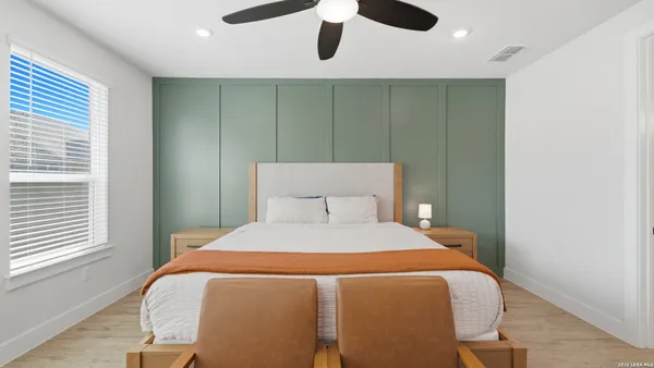 a bedroom with a bed and window