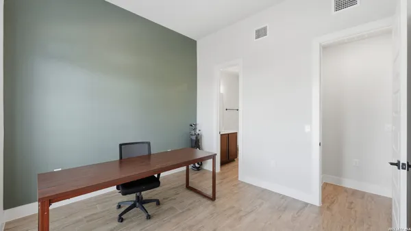 a view of a workspace with furniture