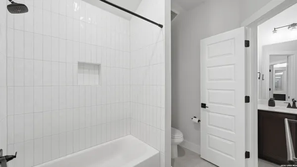a bathroom with a sink vanity and a mirror
