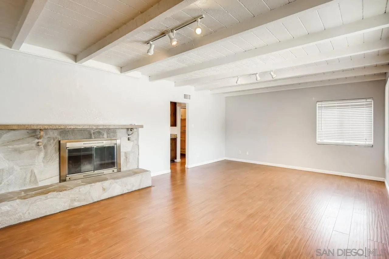 139 Landale Lane El Cajon, CA 92019 - Photo 2 of 11 wooden floor in an empty room with a fireplace