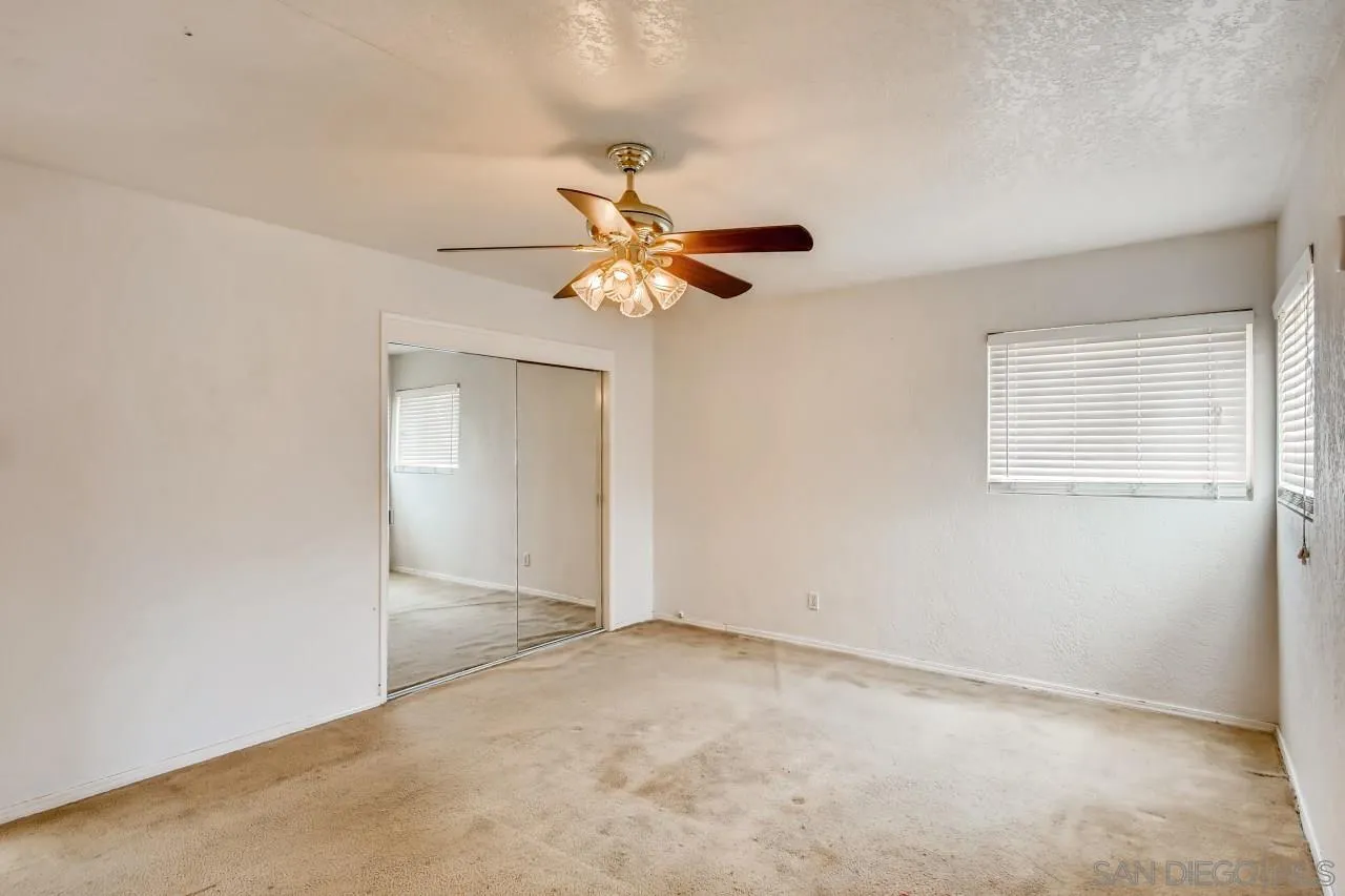 139 Landale Lane El Cajon, CA 92019 - Photo 5 of 11 an empty room with closet and a chandelier fan