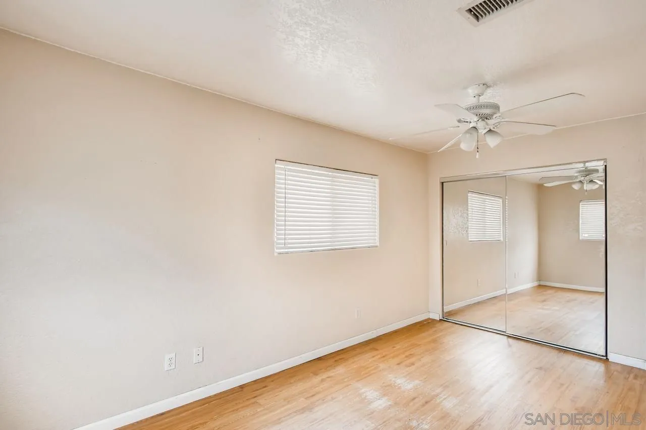 139 Landale Lane El Cajon, CA 92019 - Photo 7 of 11 an empty room with a ceiling fan and carpet