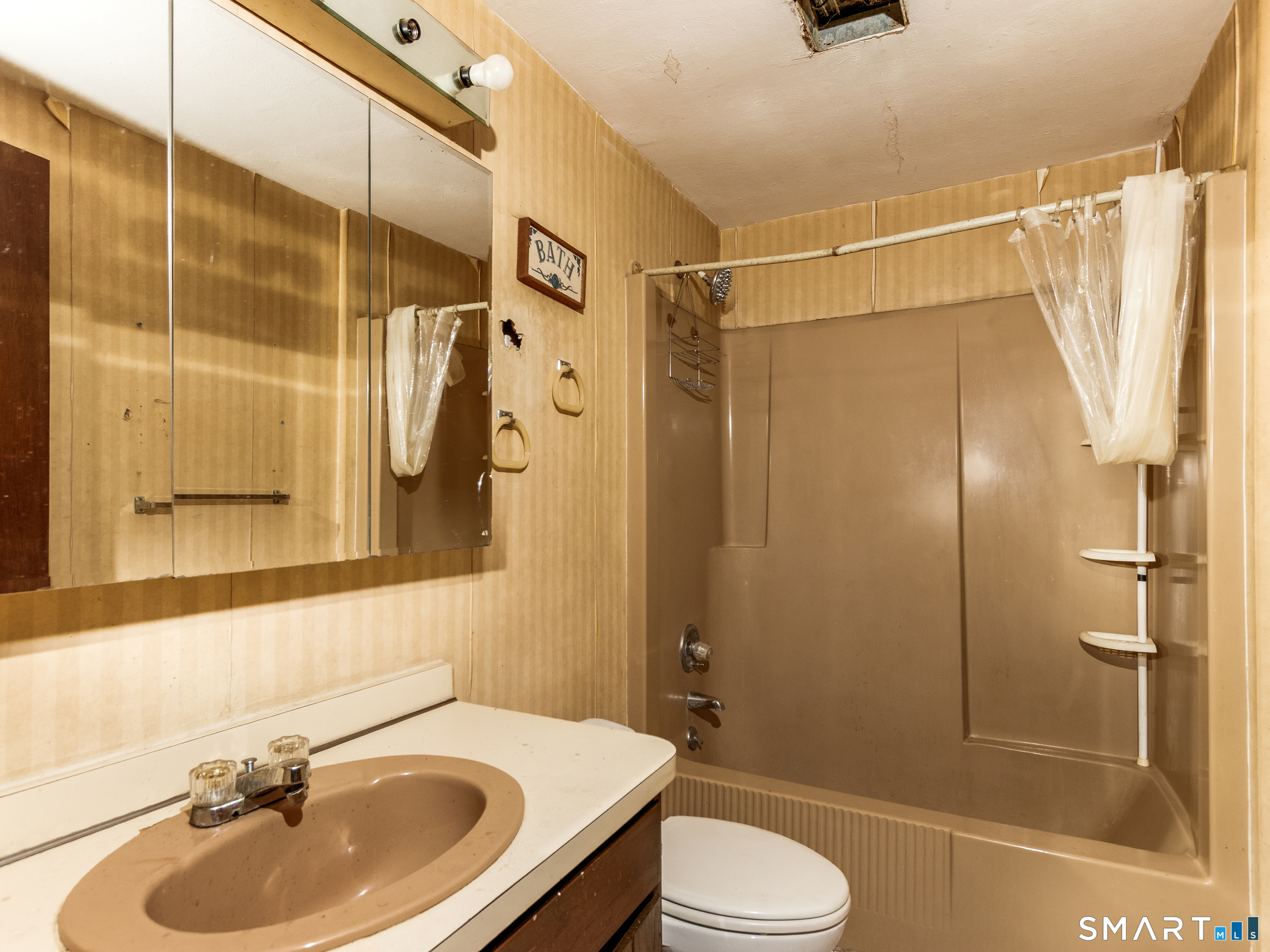 63 High Hill Road Wallingford, CT 06492 - Photo 27 of 34 a bathroom with a sink toilet and shower