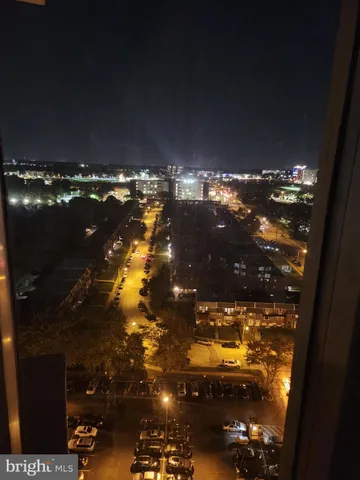 a kitchen with a sink a stove top oven and cabinetry