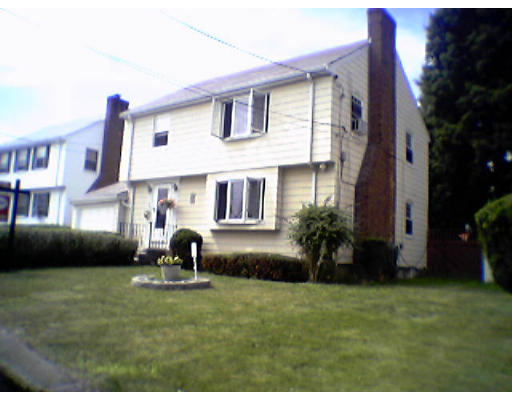 47 Clancy Road Boston, MA 02124 - Photo 11 of 11 a front view of a house with a garden