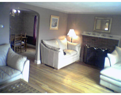 47 Clancy Road Boston, MA 02124 - Photo 2 of 11 a living room with furniture and a lamp
