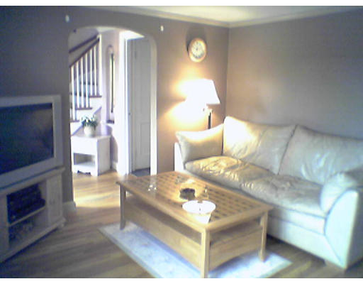 47 Clancy Road Boston, MA 02124 - Photo 3 of 11 a living room with furniture and a fireplace