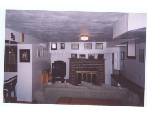 47 Clancy Road Boston, MA 02124 - Photo 5 of 11 a view interior of a house with fireplace