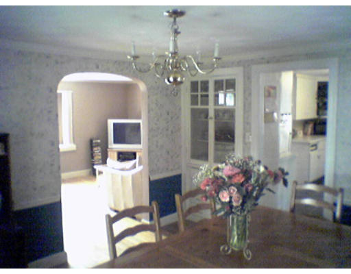 47 Clancy Road Boston, MA 02124 - Photo 8 of 11 a view of a dining room with furniture and a chandelier