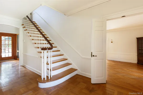 a room with wooden floor and furniture