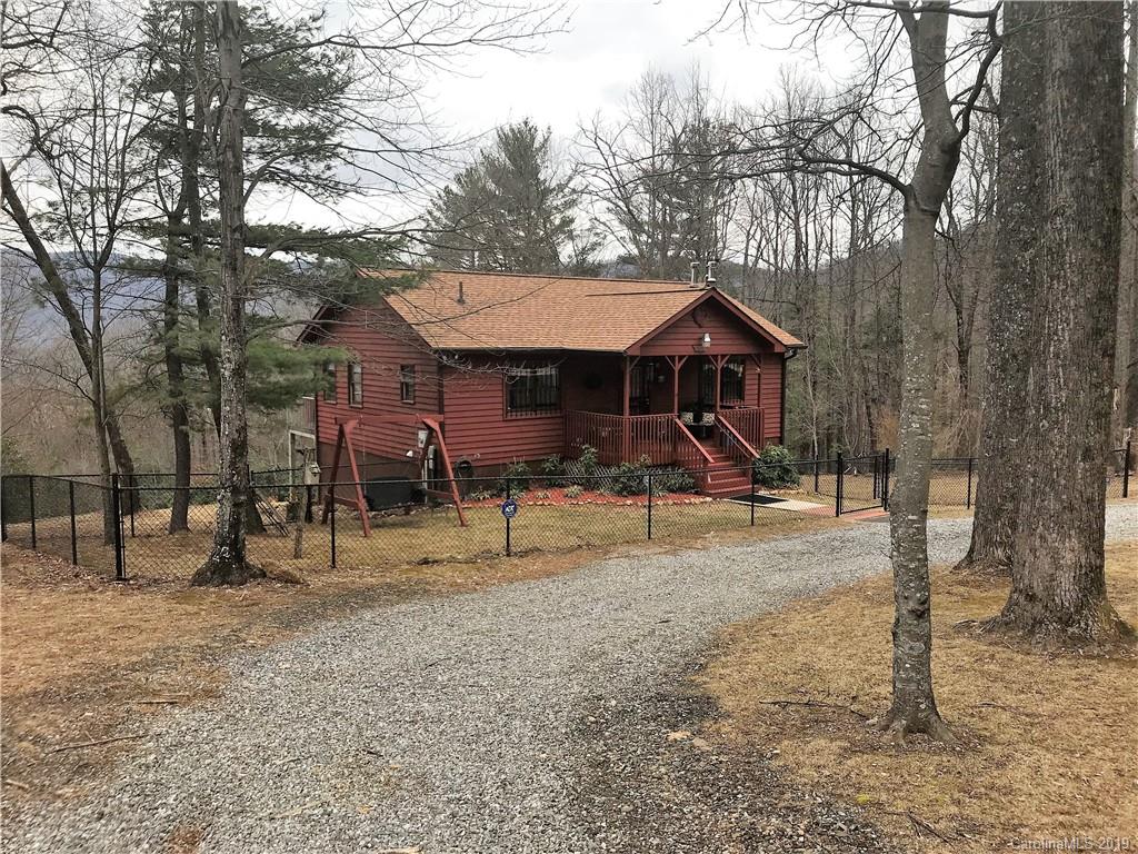 707 Phillips Gap Road Purlear, NC 28665 - Photo 2 of 27 a view of a house with a yard and sitting area