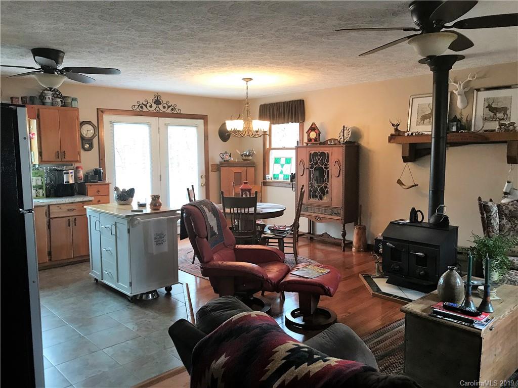 707 Phillips Gap Road Purlear, NC 28665 - Photo 12 of 27 a living room with furniture and a flat screen tv