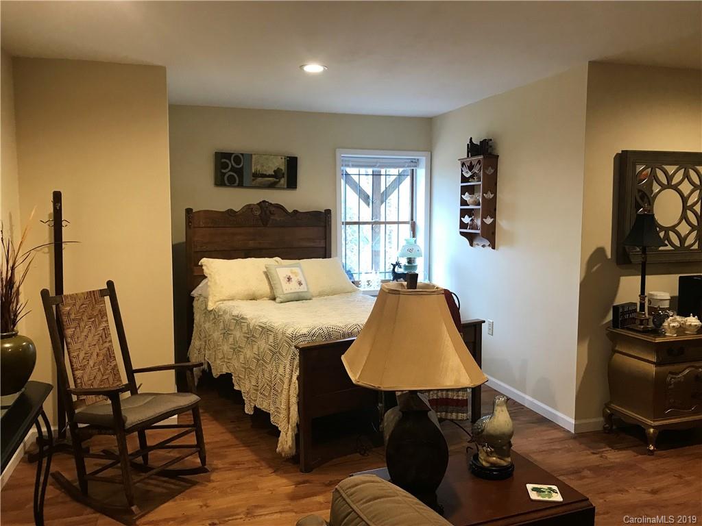 707 Phillips Gap Road Purlear, NC 28665 - Photo 20 of 27 a living room with furniture and a window