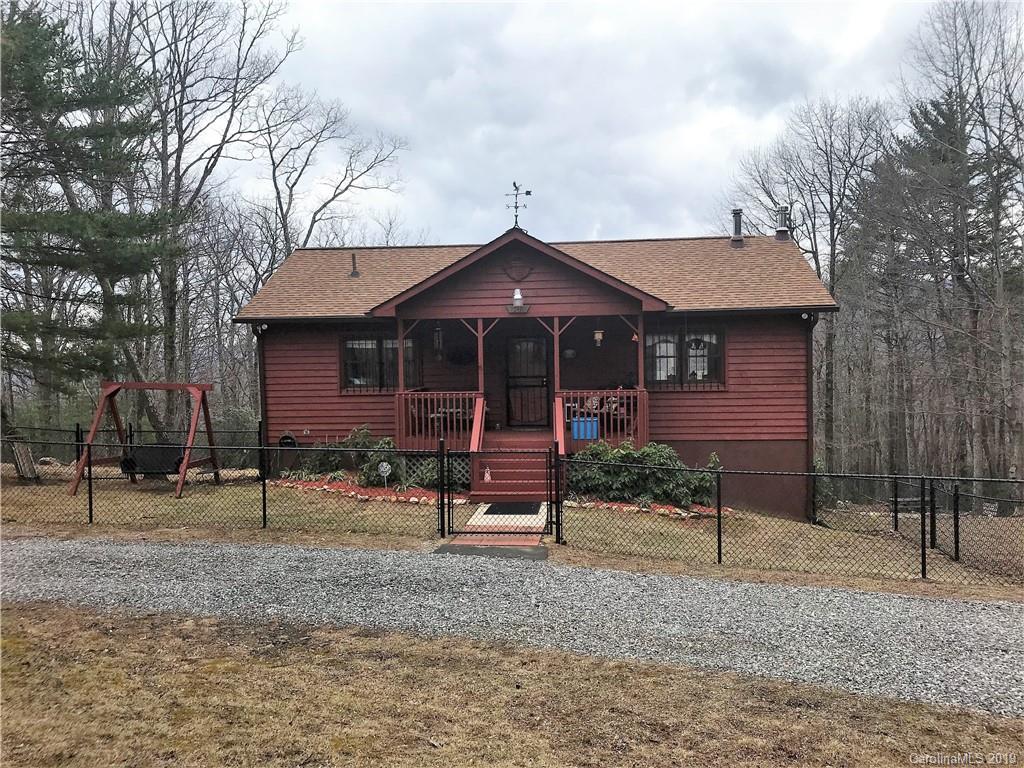 707 Phillips Gap Road Purlear, NC 28665 - Photo 3 of 27 a front view of a house with a yard