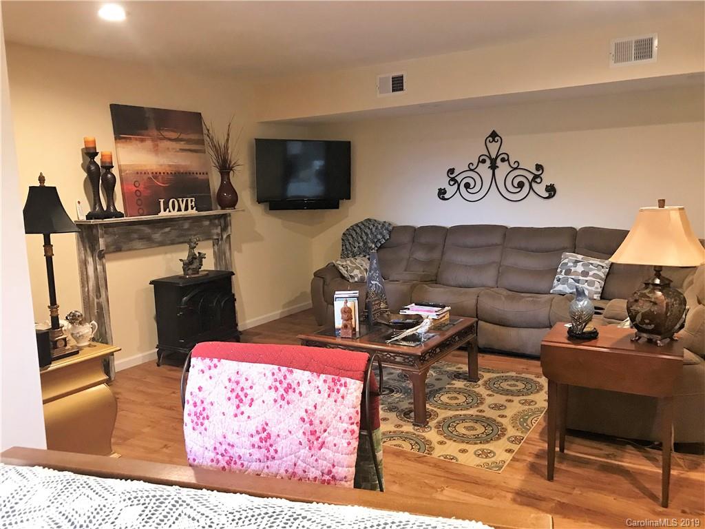 707 Phillips Gap Road Purlear, NC 28665 - Photo 21 of 27 a living room with furniture and a flat screen tv
