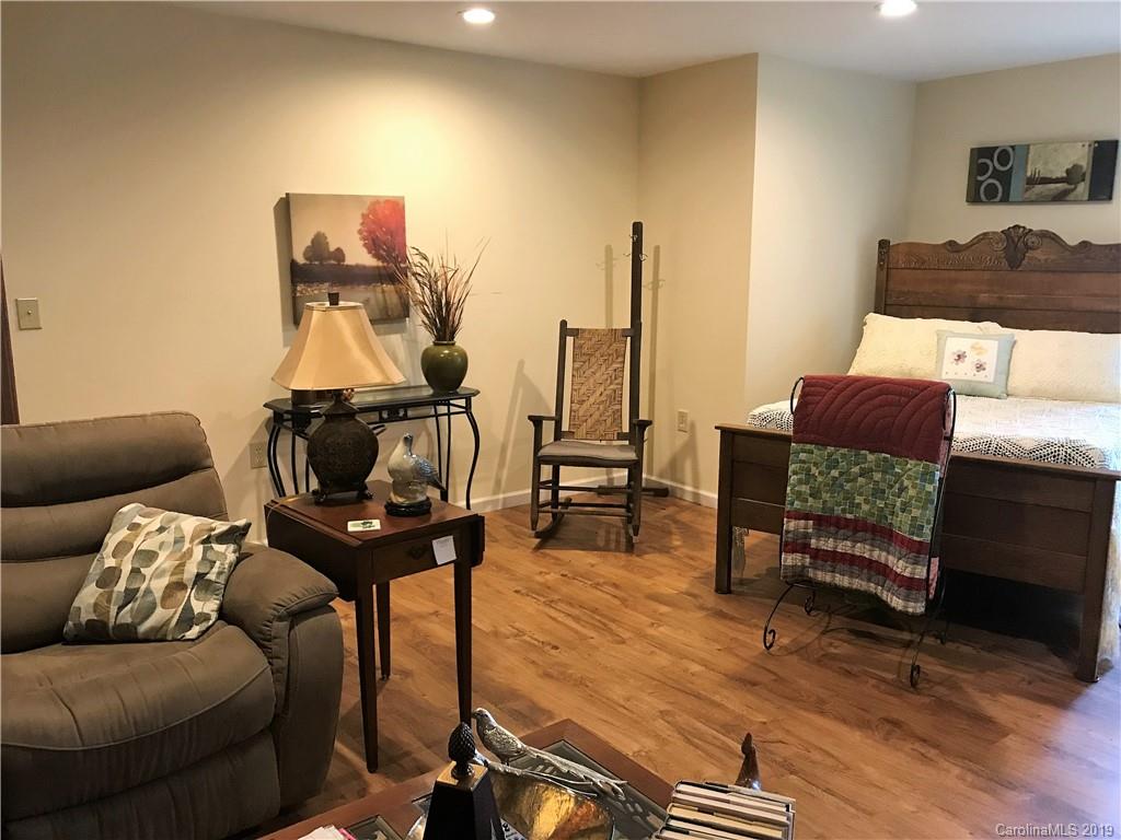 707 Phillips Gap Road Purlear, NC 28665 - Photo 24 of 27 a living room with furniture and wooden floor