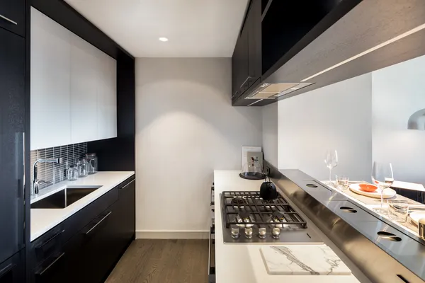 a kitchen with a sink and cabinets