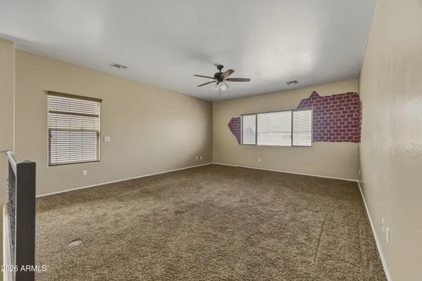 a view of a hallway view with staircase