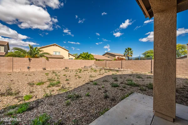 a view of a backyard of the house