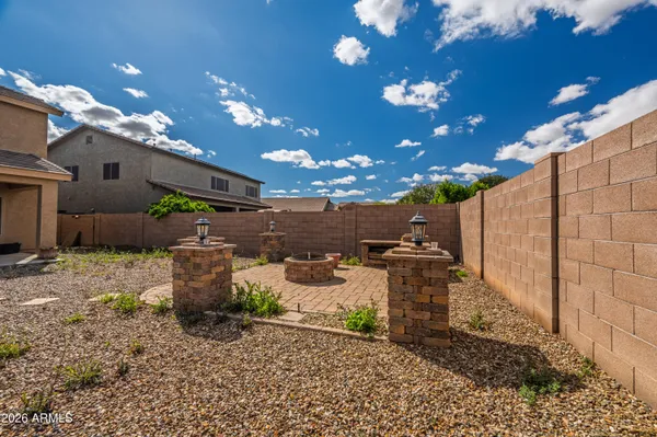 a view of a backyard with large trees