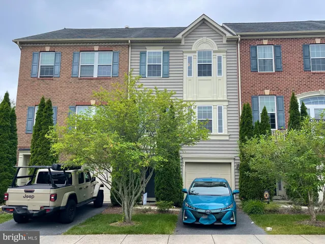 a car parked in front of a house