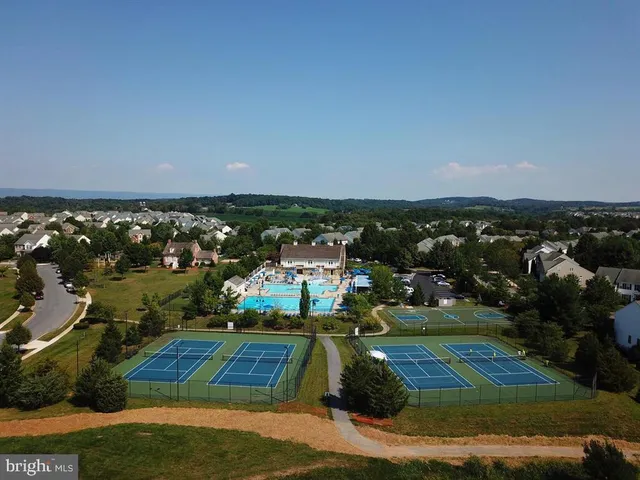 a view of a swimming pool with outdoor seating