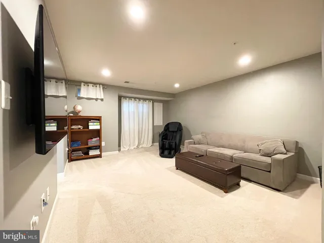 a room with furniture and a flat screen tv