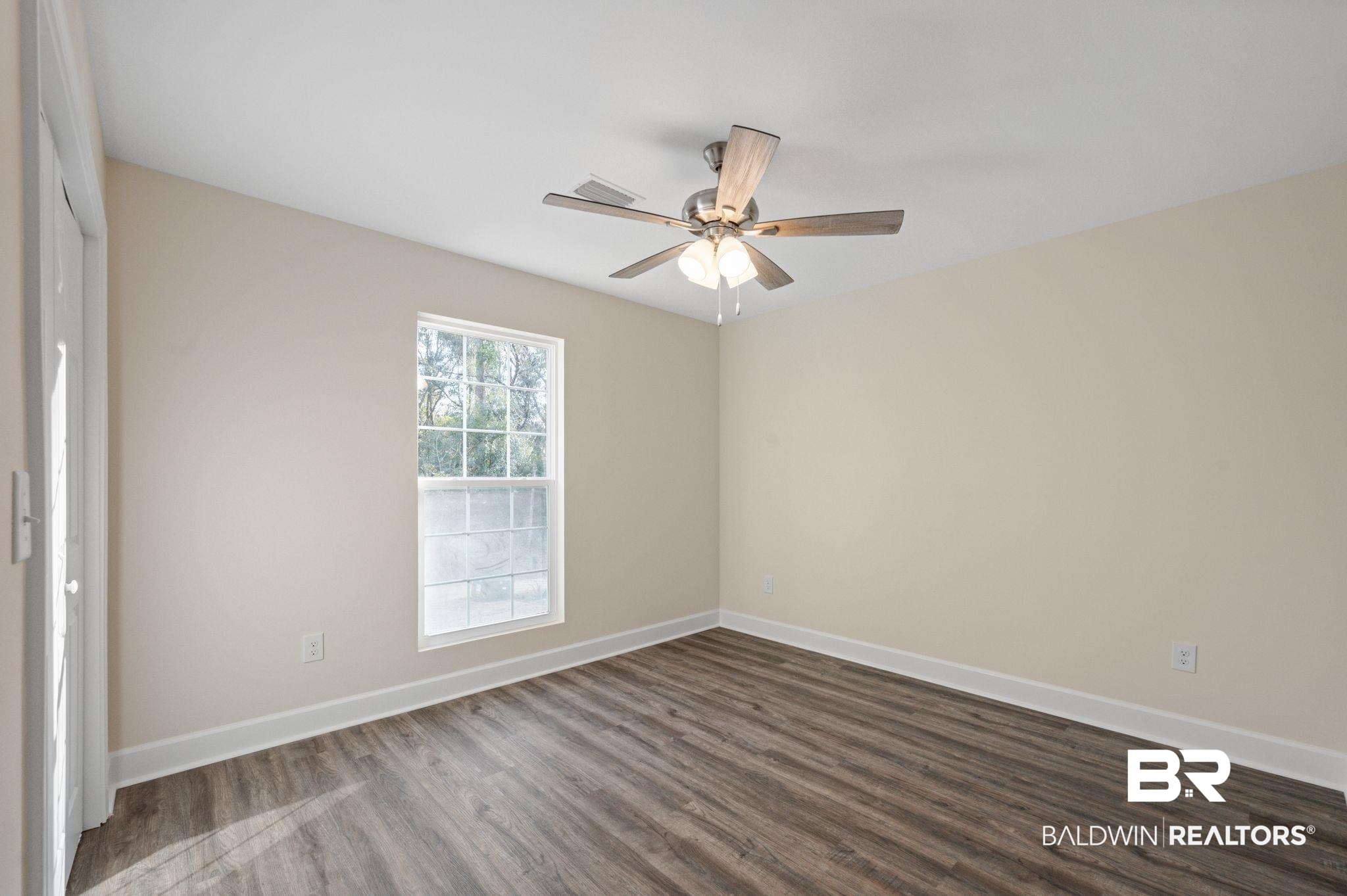 1473 Pollard Road Daphne, AL 36526 - Photo 24 of 32 Empty room featuring dark hardwood / wood-style flooring and ceiling fan