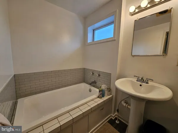 a bedroom with a bed and a tv