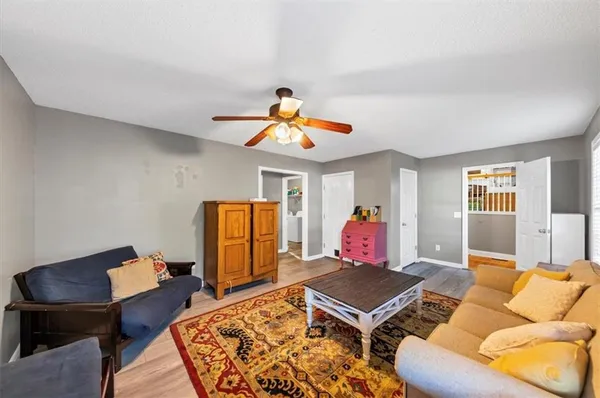 a living room with furniture rug and window