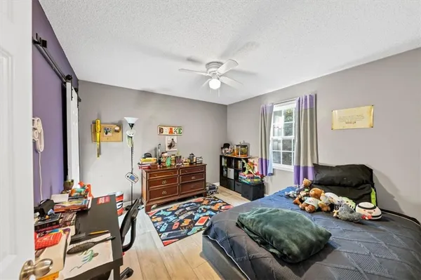 a bathroom with a toilet a sink and shower