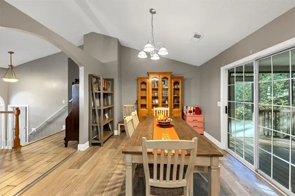 a view of a dining room with furniture window and wooden floor