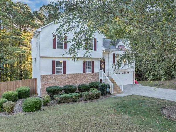 front view of a house with a yard