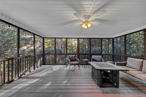 a view of a backyard with swimming pool