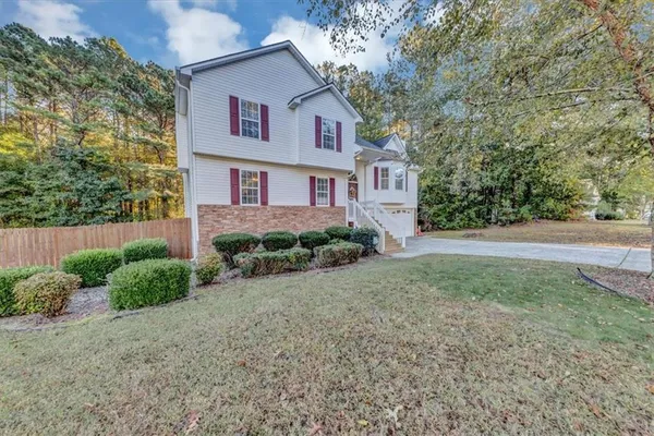 a front view of a house with garden