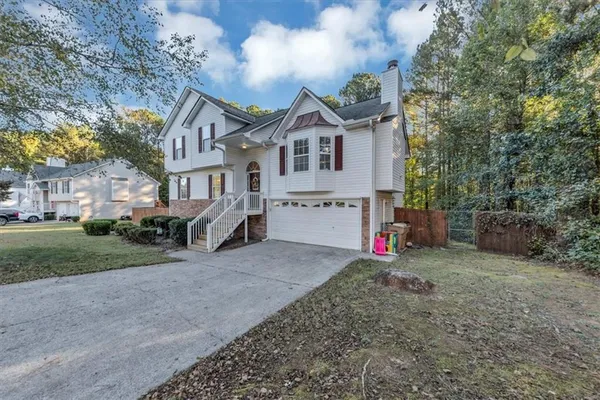 a view of house with outdoor space