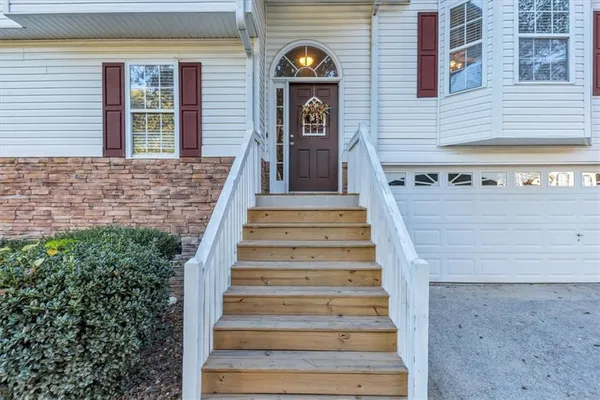 a view of a brick house with a large windows