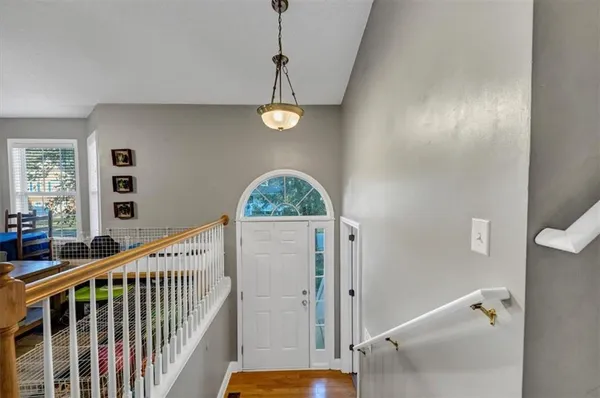 a view of a hallway with windows