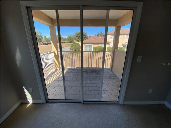 a bathroom with a granite countertop sink a toilet and a mirror